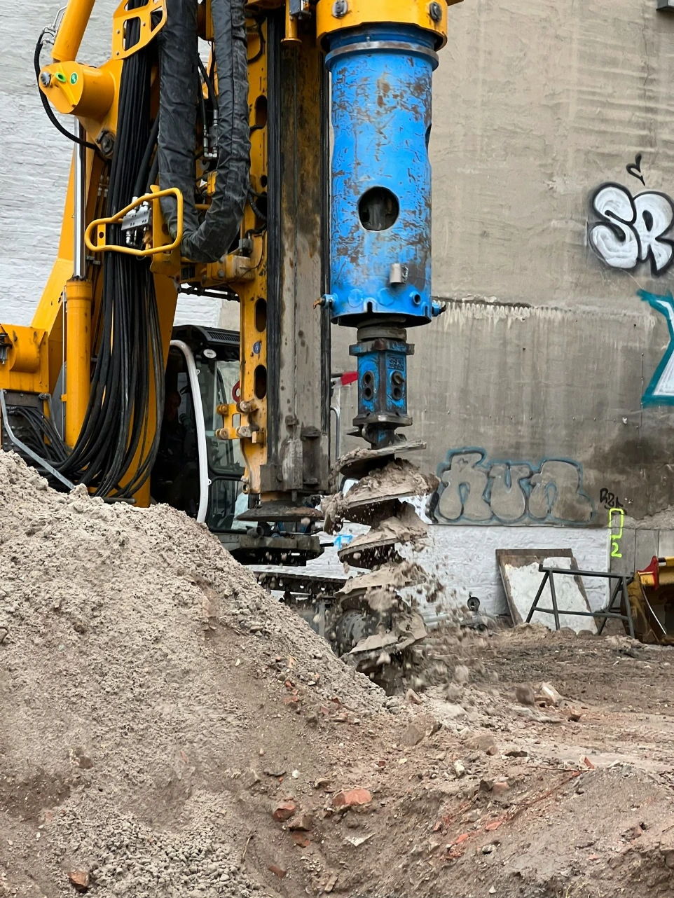 a construction site with a large machine in the middle of it